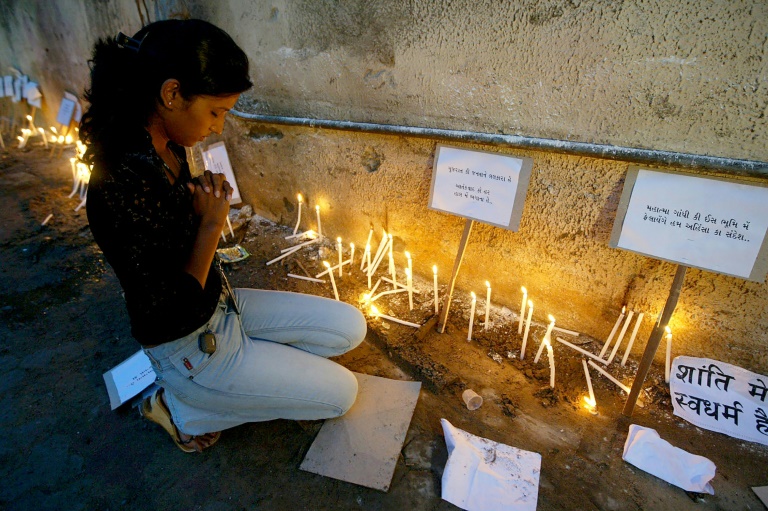 A woman pays tribute to victims of the 2008 Ahmedabad attacks