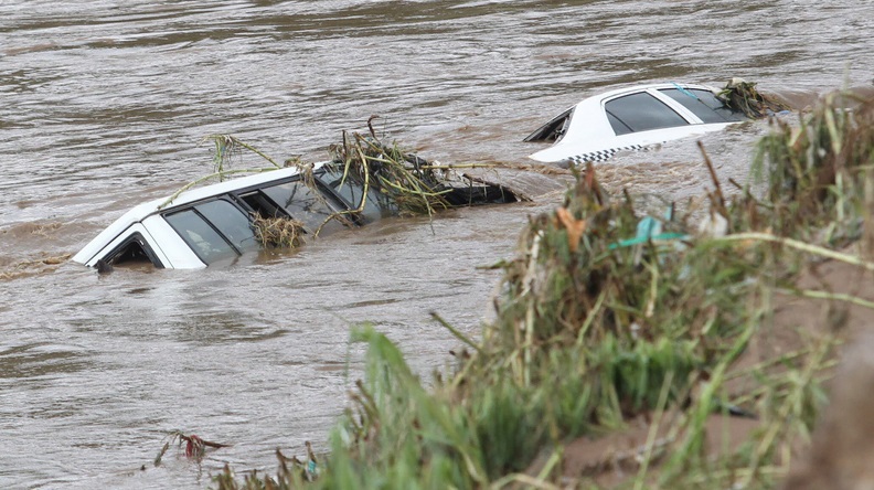 Vehicles almost totally submerged following flooding in Durban