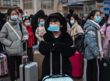 Travellers wearing masks in Wuhan