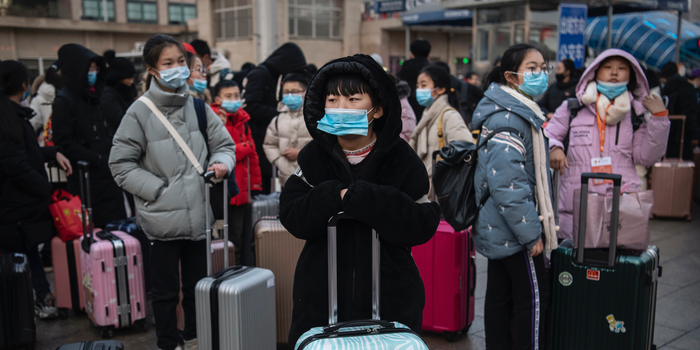 Travellers wearing masks in Wuhan