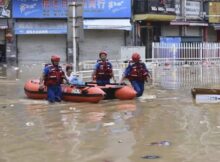 Rescue workers saving residents from flooding in China