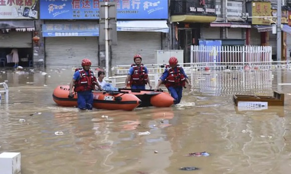 Rescue workers saving residents from flooding in China
