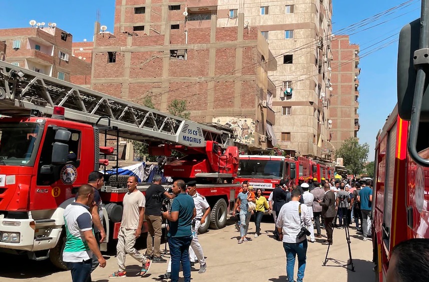 Fire crews attend the blaze at a church in Giza
