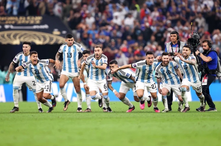 Argentina's players burst into celebration as the winning penalty is scored