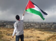 A man waves the Palestinian flag