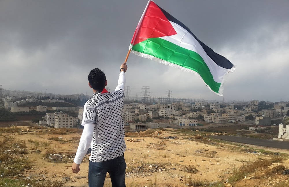 A man waves the Palestinian flag